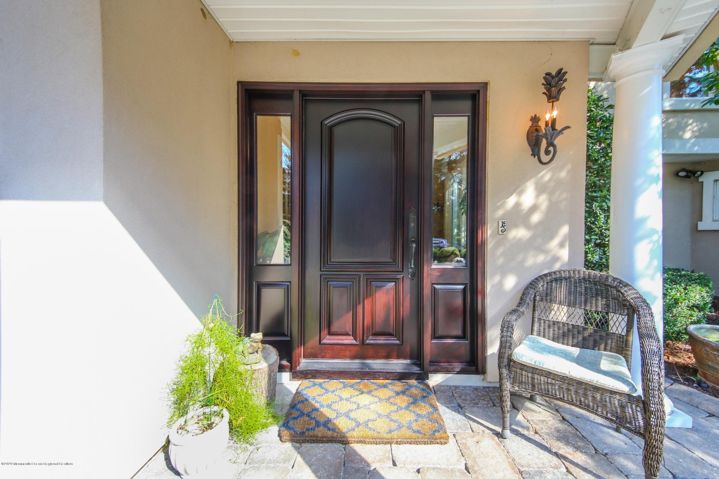 18 Daniel Drive Little Silver, NJ 07739 - Photo 6 of 55 a front view of a house with a porch