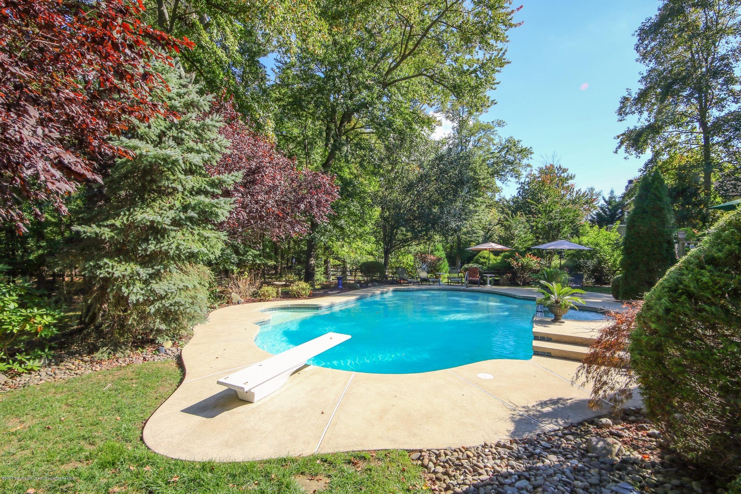 18 Daniel Drive Little Silver, NJ 07739 - Photo 7 of 55 a view of a swimming pool with a yard