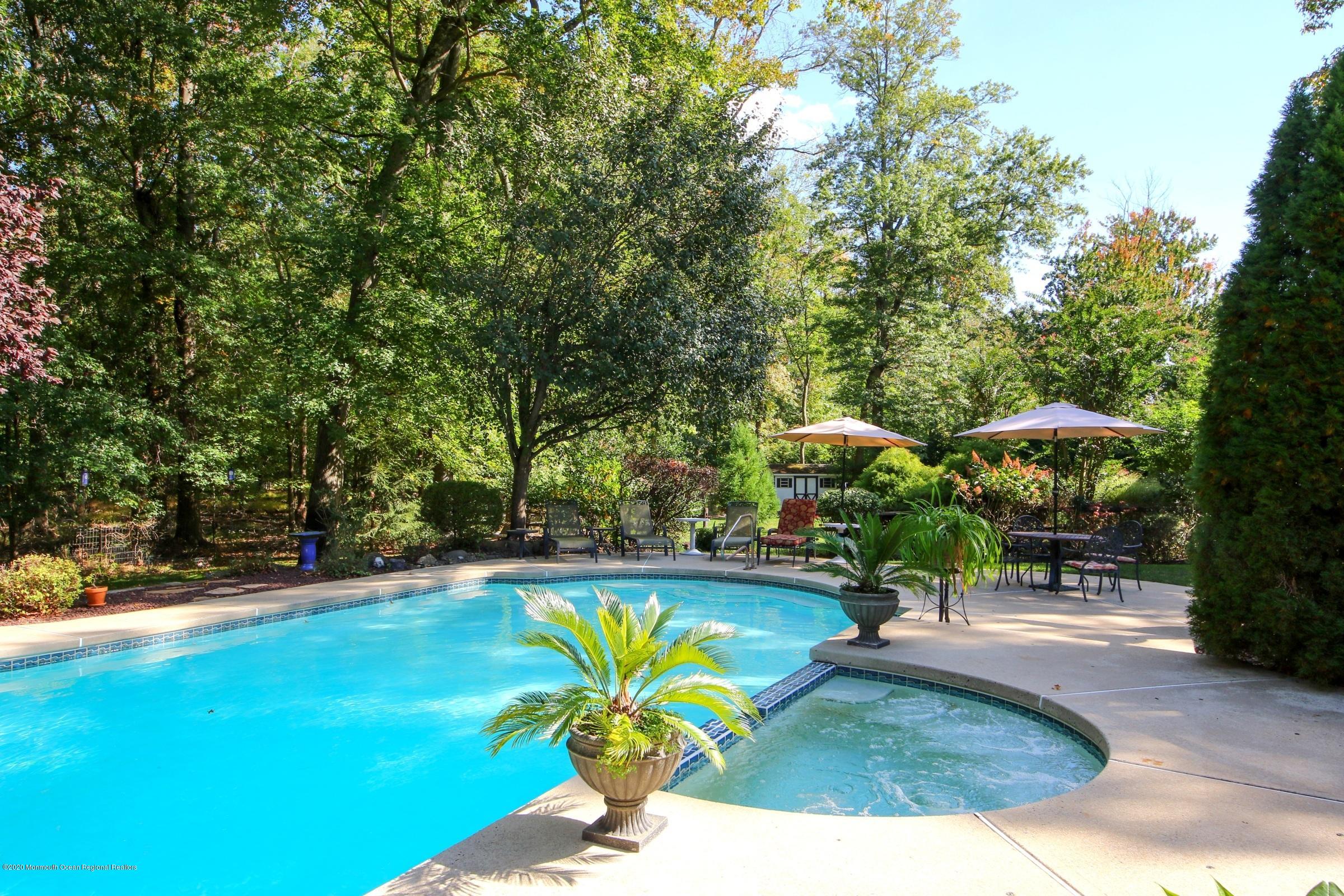 18 Daniel Drive Little Silver, NJ 07739 - Photo 8 of 55 a view of yard with swimming pool and sitting area
