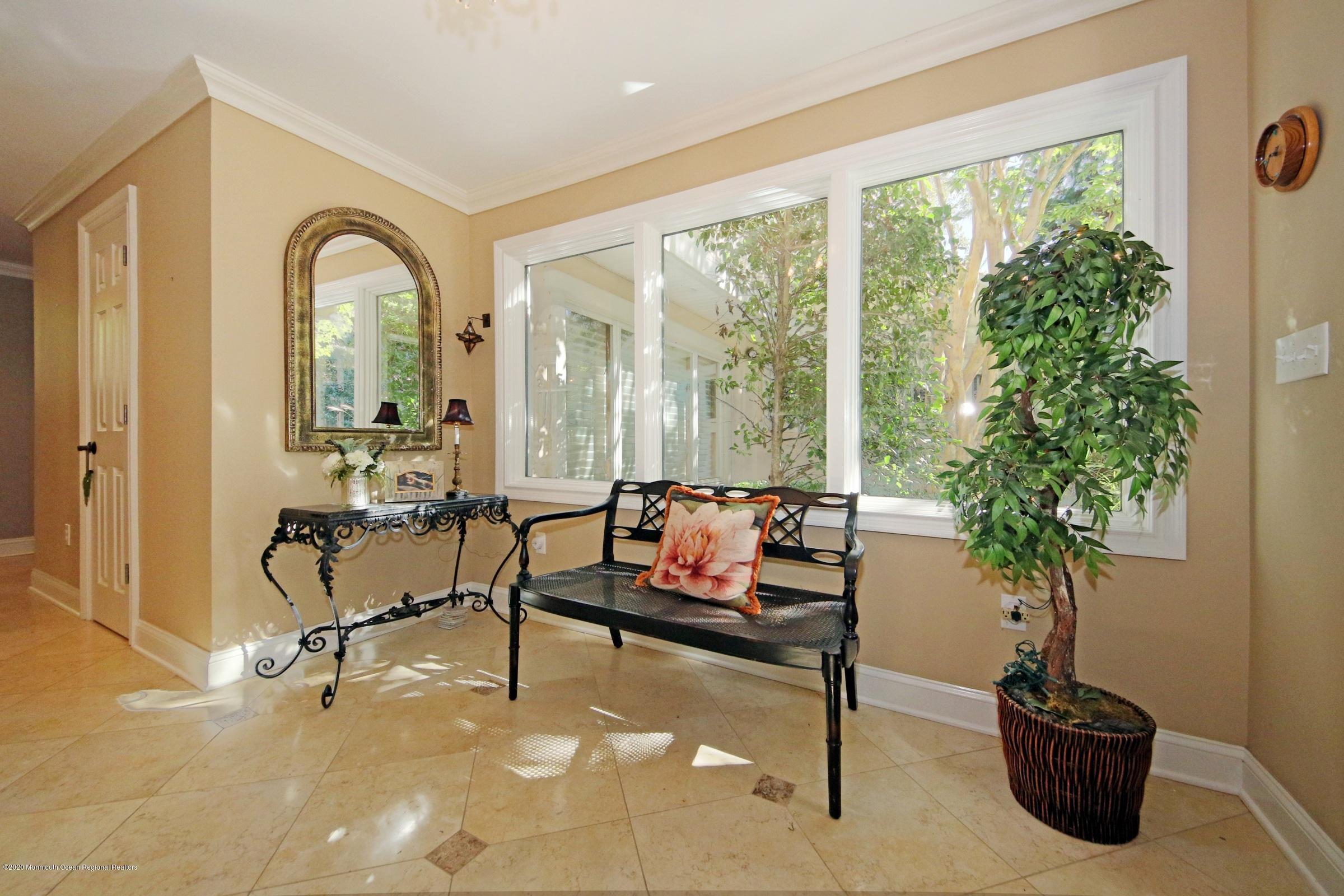 18 Daniel Drive Little Silver, NJ 07739 - Photo 10 of 55 a living room with furniture potted plant and a large window