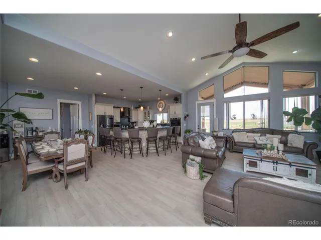 a living room with lots of furniture and view of living room