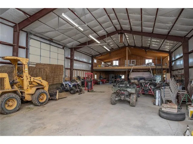 a view of a terrace with a wooden fence