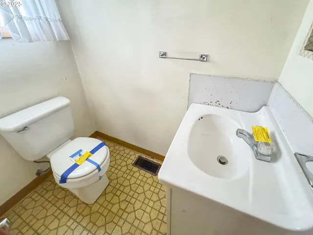 a bathroom with a sink and a toilet