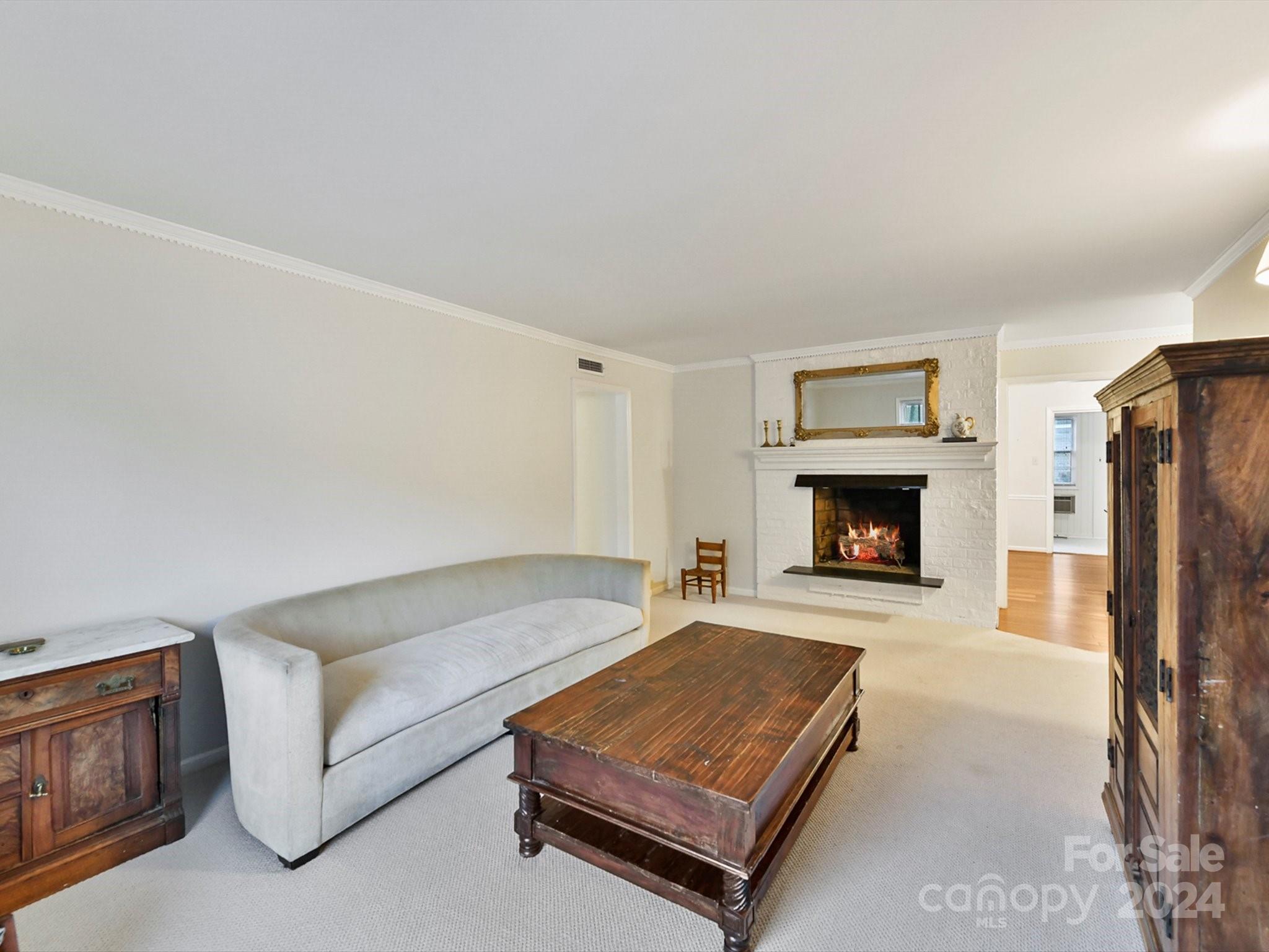 1708 Roxborough Road, Unit E Charlotte, NC 28211 - Photo 7 of 20 a living room with furniture and a fireplace