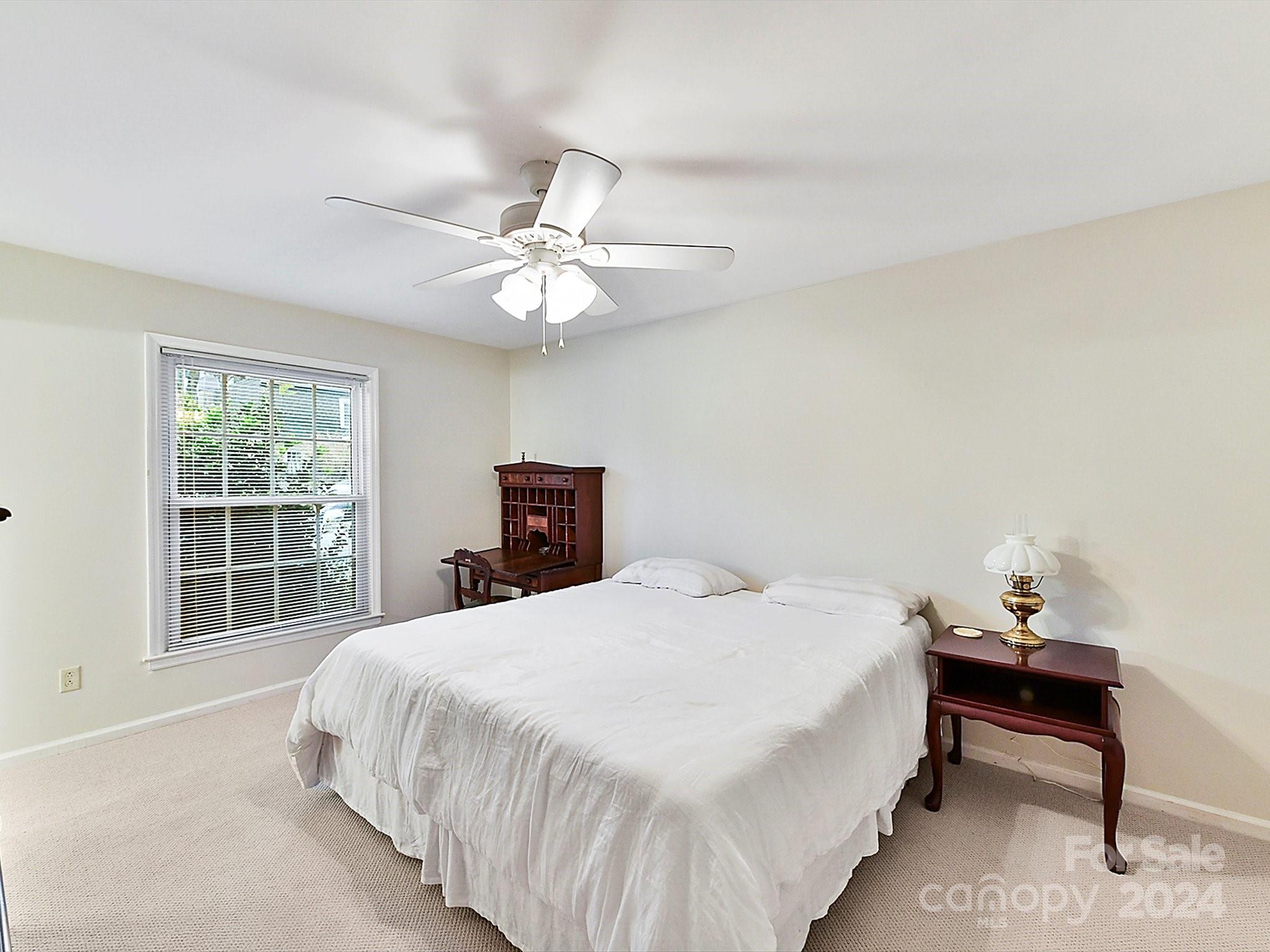 1708 Roxborough Road, Unit E Charlotte, NC 28211 - Photo 9 of 20 a bedroom with a bed and a window