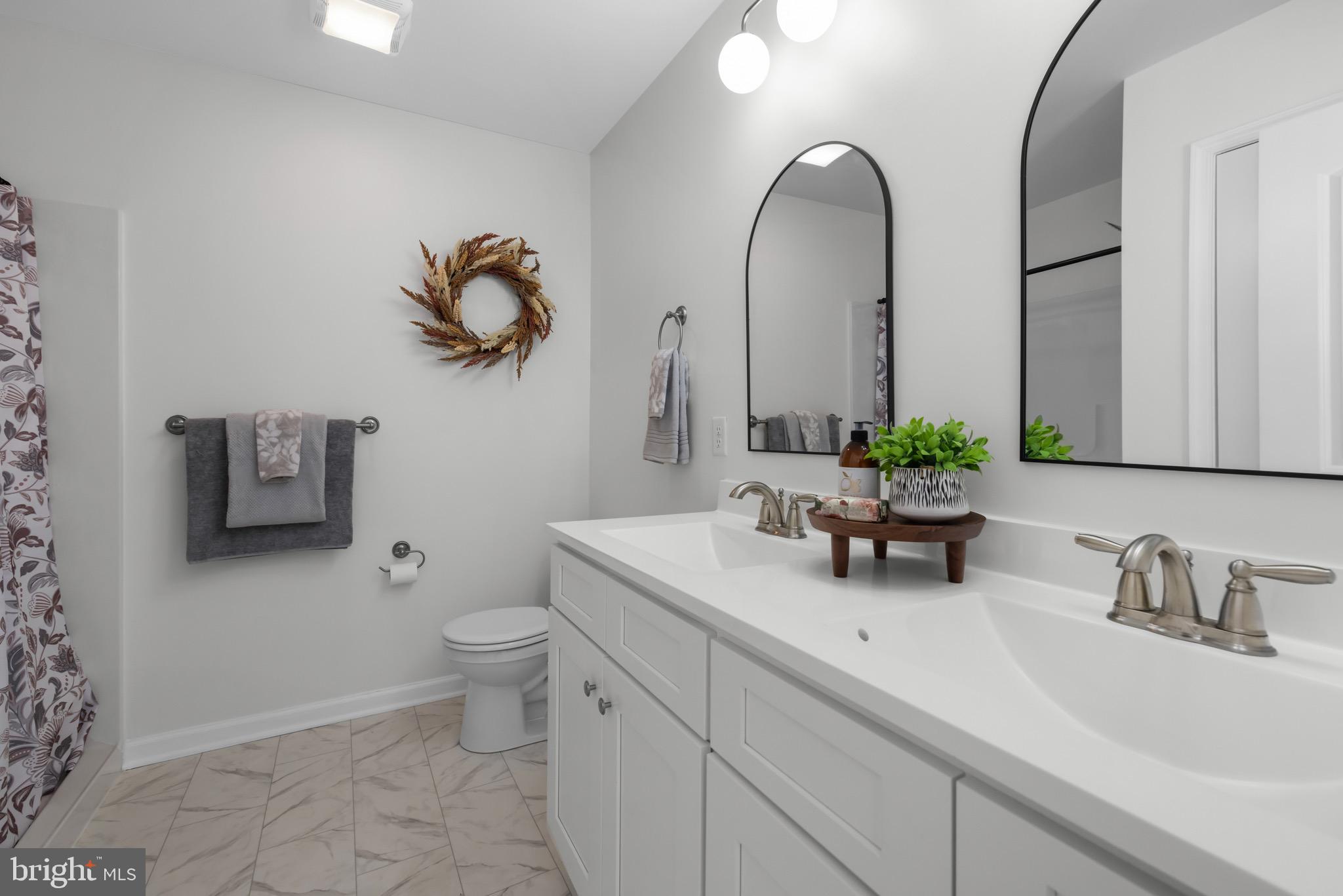 733 Red Bird Lane Harpers Ferry, WV 25425 - Photo 17 of 29 a bathroom with a toilet sink and mirror