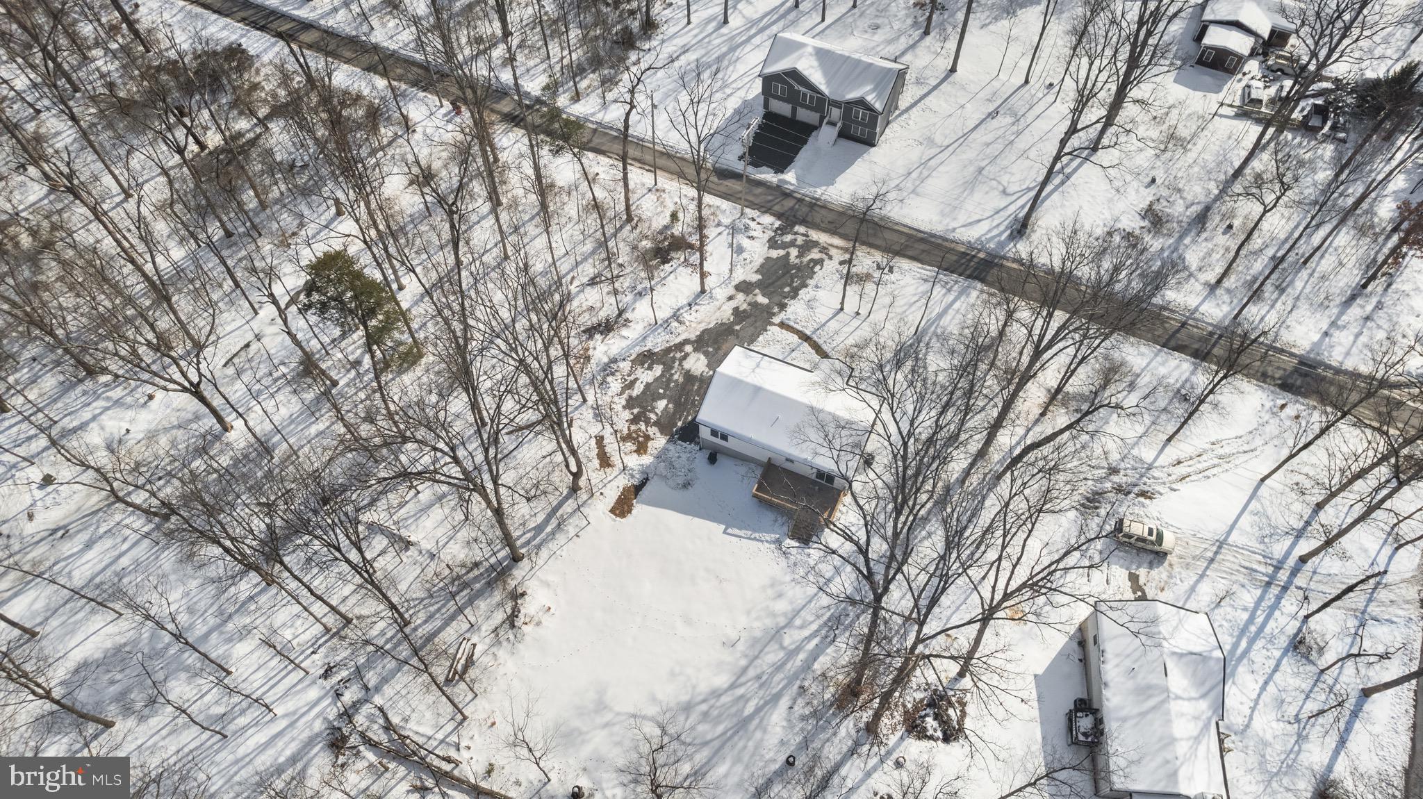 733 Red Bird Lane Harpers Ferry, WV 25425 - Photo 27 of 29 a backyard of a house with large trees