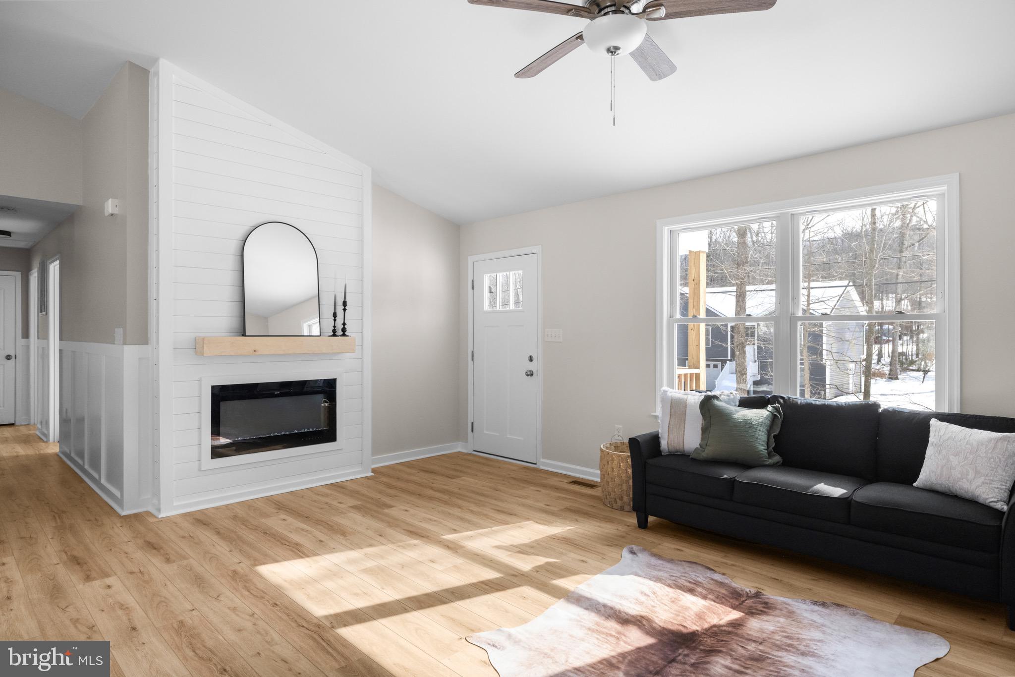 733 Red Bird Lane Harpers Ferry, WV 25425 - Photo 3 of 29 a living room with furniture and a fireplace