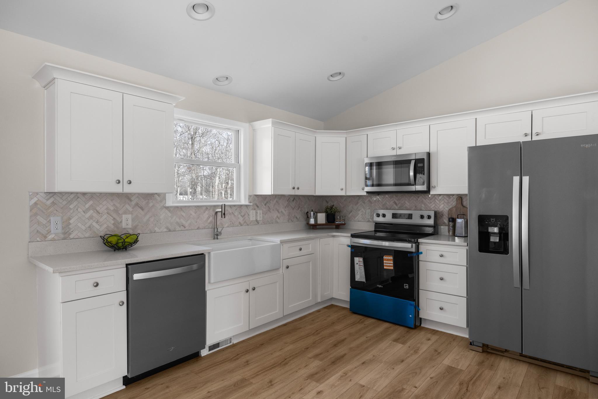 733 Red Bird Lane Harpers Ferry, WV 25425 - Photo 10 of 29 a kitchen with a white cabinets and white appliances