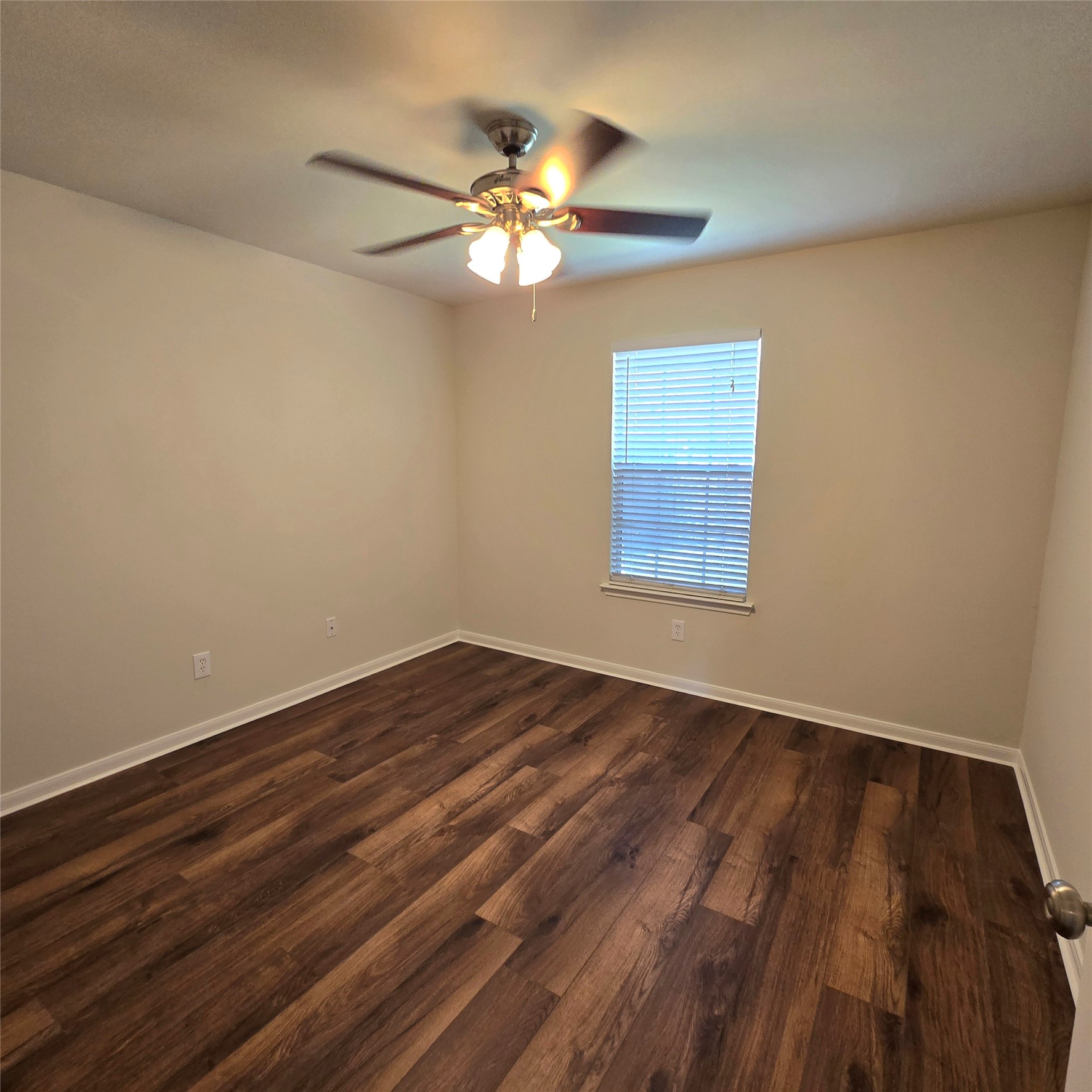 6411 Slate Stone Street Houston, TX 77084 - Photo 15 of 38 Bright third bedroom with elegant wood floors and a ceiling fan.