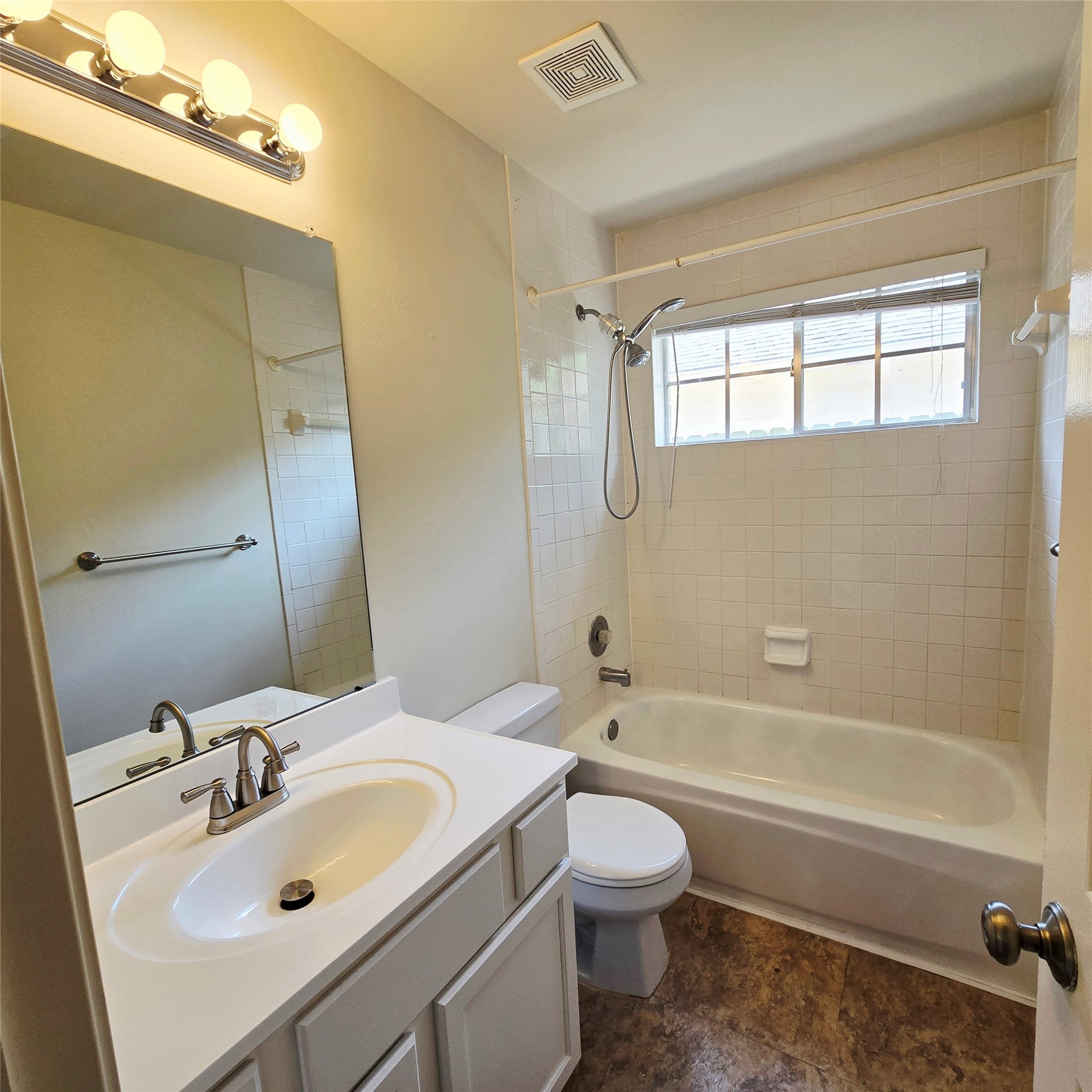 6411 Slate Stone Street Houston, TX 77084 - Photo 16 of 38 Second bathroom with modern lighting and convenient tub/shower combo.