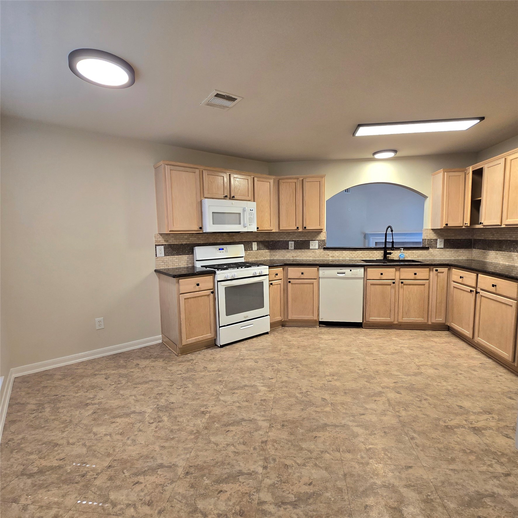 6411 Slate Stone Street Houston, TX 77084 - Photo 21 of 38 Well laid-out kitchen with lots of cabinets and lighting.