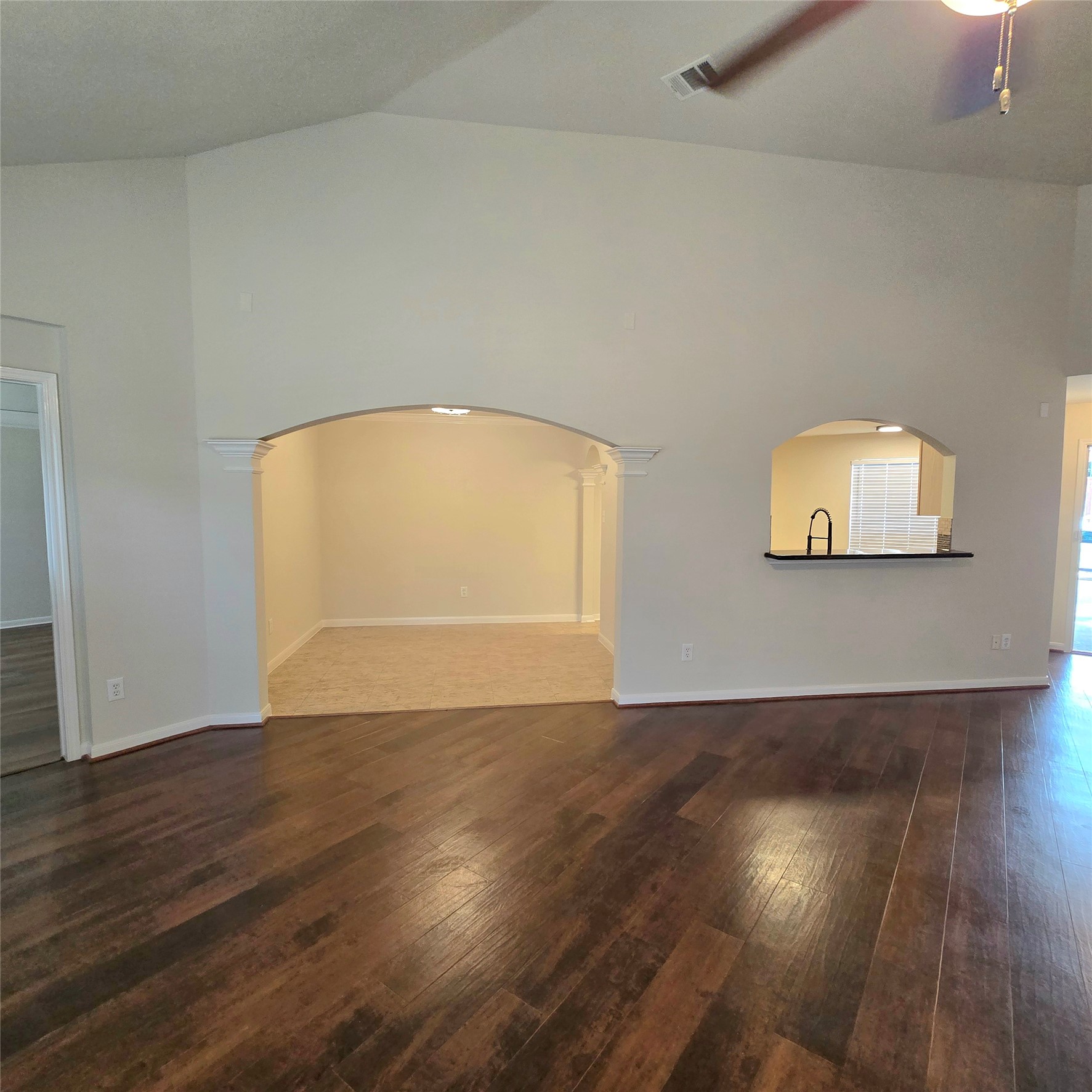 6411 Slate Stone Street Houston, TX 77084 - Photo 24 of 38 Spacious family room with high ceiling. Pass-through bar to the kitchen, and adjacent to a private dining area.