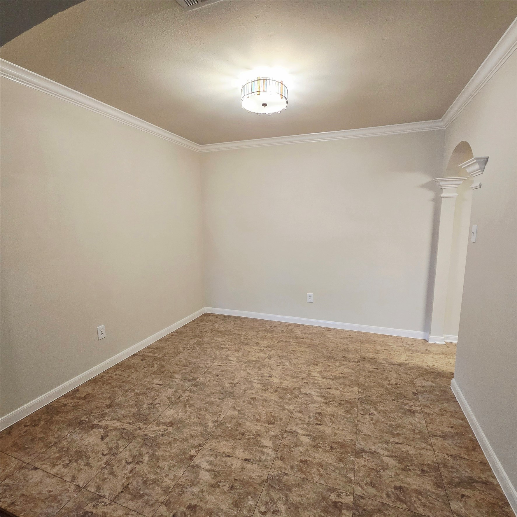 6411 Slate Stone Street Houston, TX 77084 - Photo 25 of 38 Elegant dining room with a modern light fixture and tiled flooring, perfect for intimate gatherings.