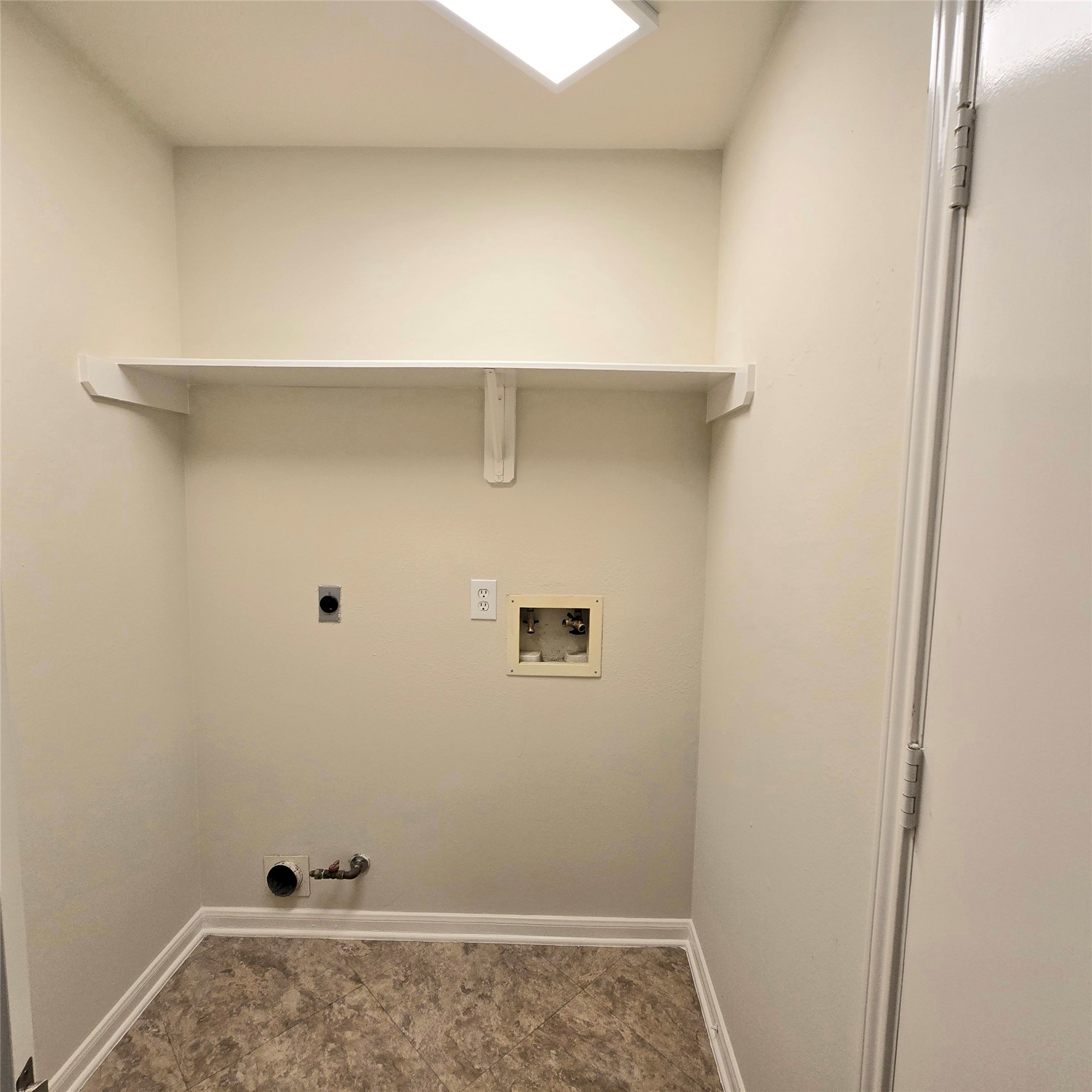 6411 Slate Stone Street Houston, TX 77084 - Photo 29 of 38 In-house bright laundry area with convenient shelves.