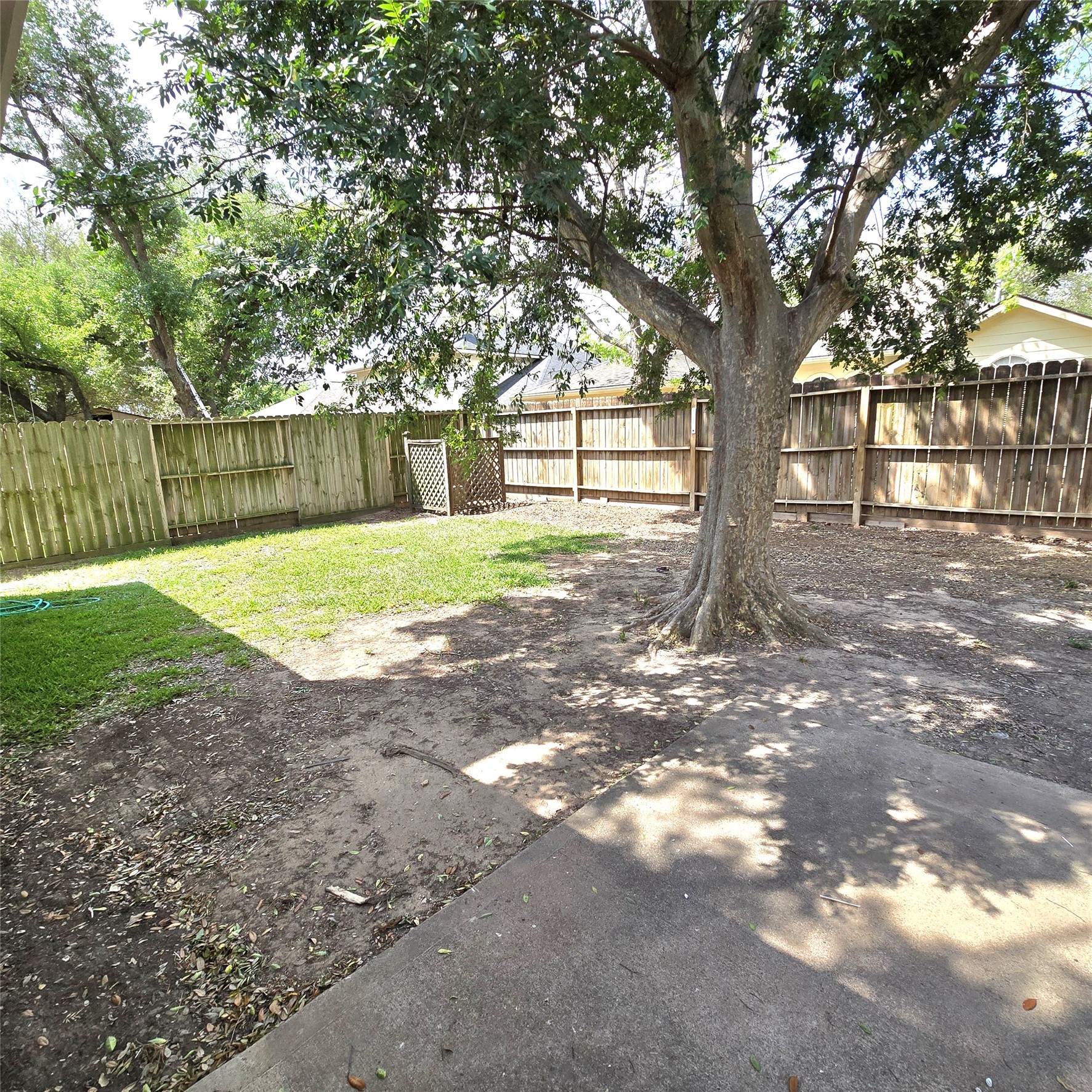 6411 Slate Stone Street Houston, TX 77084 - Photo 32 of 38 Fully-fenced backyard with a mature tree providing shade.