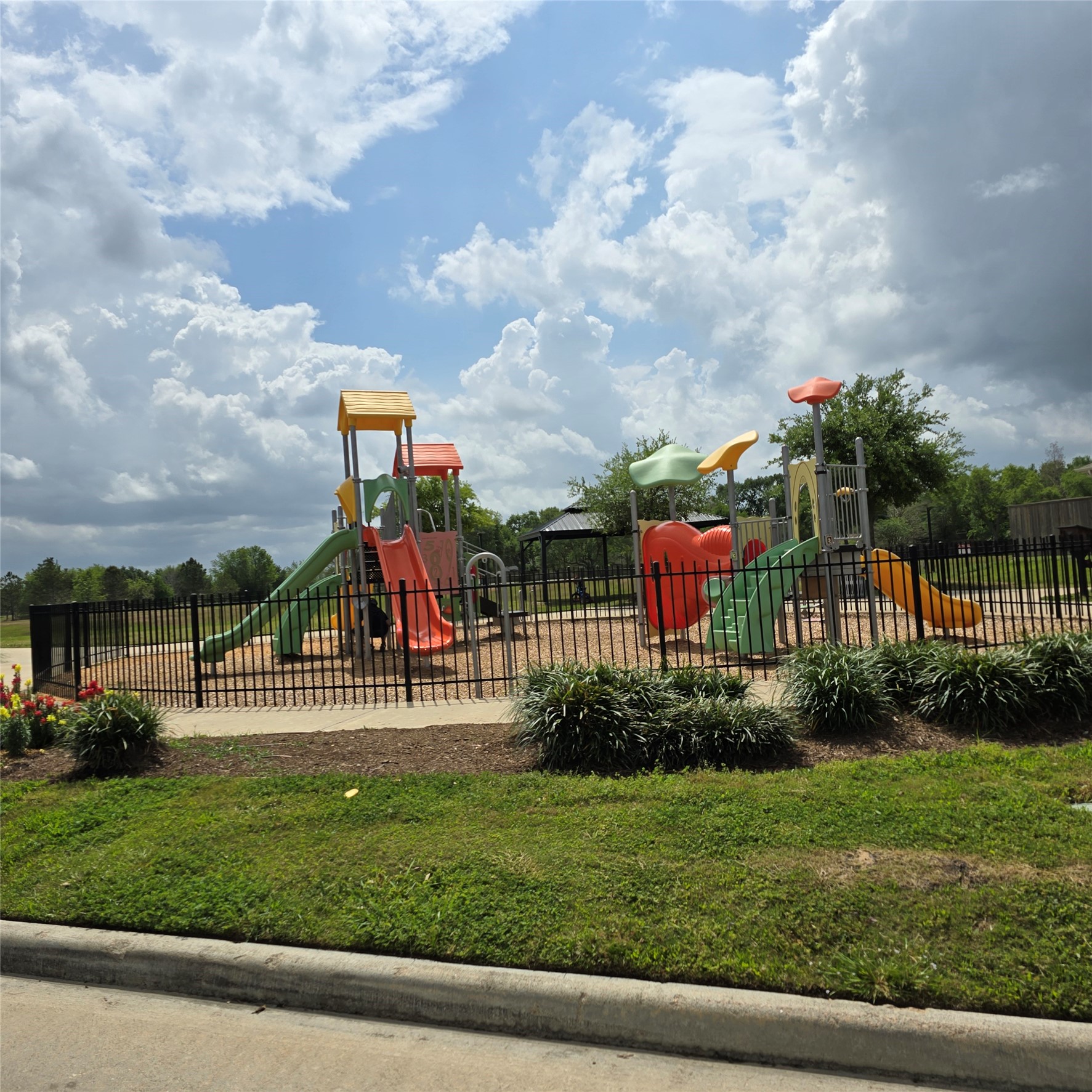 6411 Slate Stone Street Houston, TX 77084 - Photo 37 of 38 Vibrant playground perfect for family fun and outdoor activities, surrounded by lush greenery. Ideal for creating joyful memories.