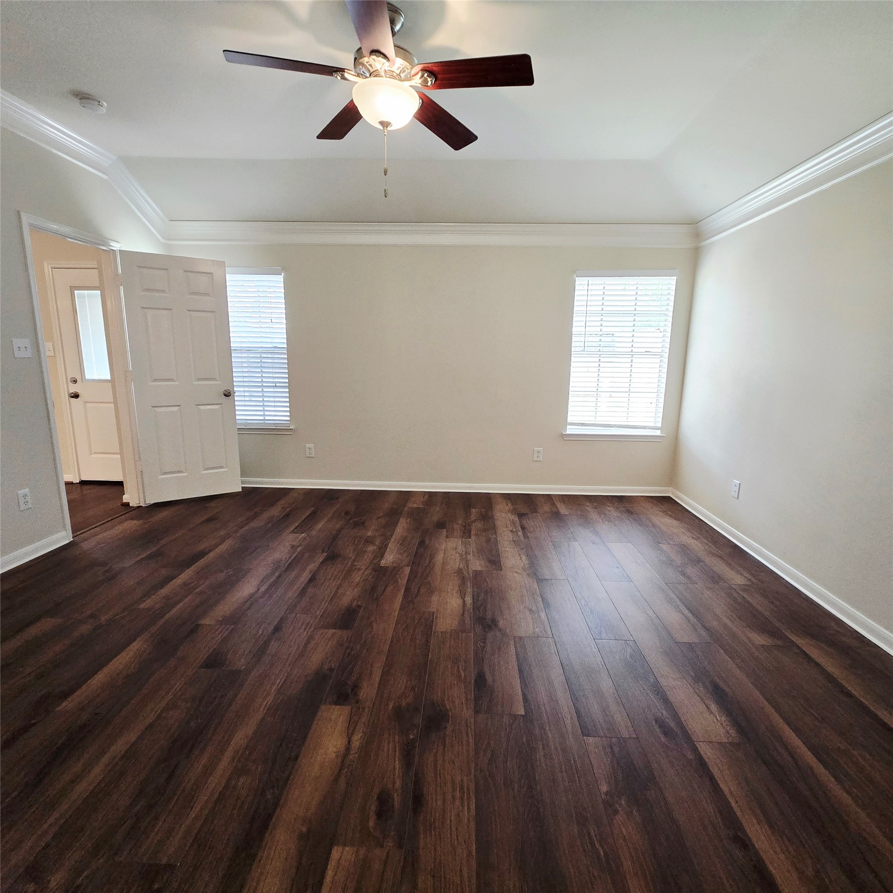 6411 Slate Stone Street Houston, TX 77084 - Photo 8 of 38 Experience abundant natural light in the primary bedroom through its large windows.