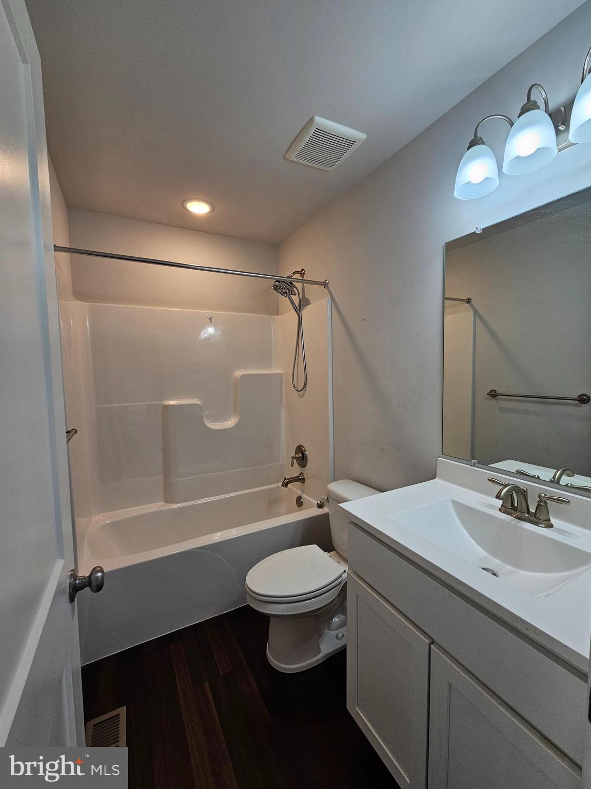 47 Bobbi Court Berkeley Springs, WV 25411 - Photo 14 of 22 a bathroom with a double vanity sink toilet mirror and shower