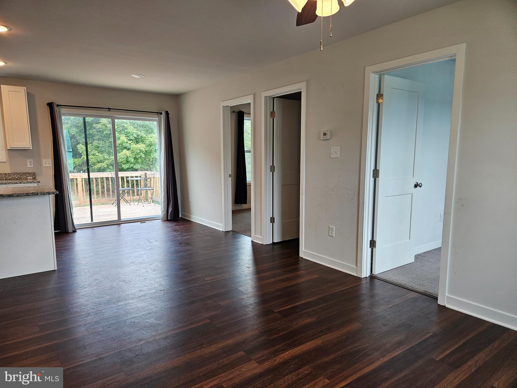 47 Bobbi Court Berkeley Springs, WV 25411 - Photo 17 of 22 an empty room with wooden floor and windows