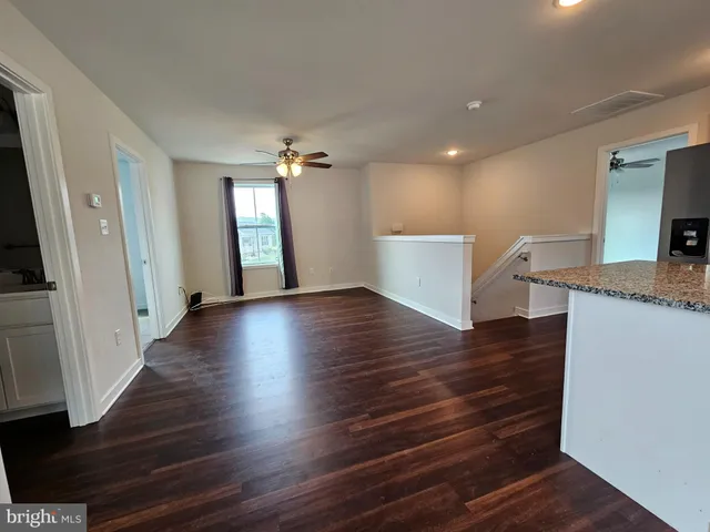 a view of a kitchen cabinets and wooden floor