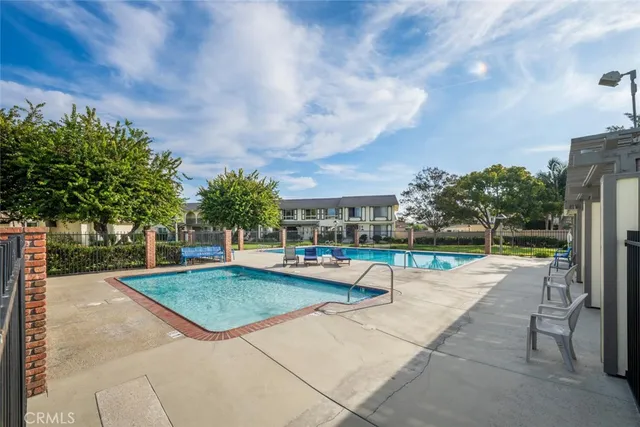 a view of a swimming pool with a lounge chair