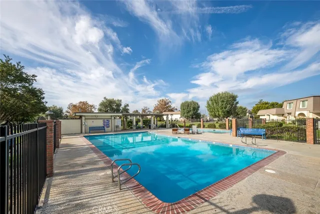 a view of a swimming pool with a yard