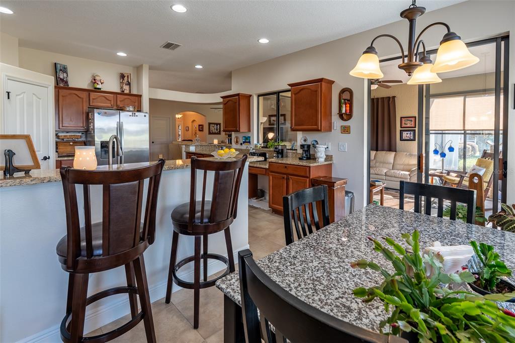 16222 Southwest 14th Avenue Road Ocala, FL 34473 - Photo 18 of 61 a view of a dining room with furniture and chandelier