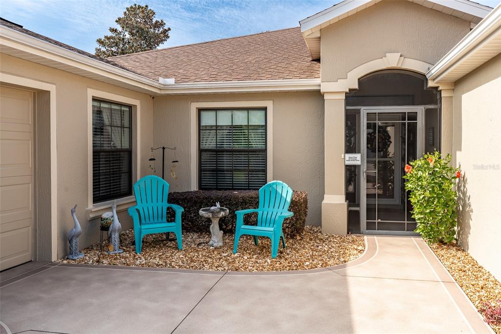 16222 Southwest 14th Avenue Road Ocala, FL 34473 - Photo 3 of 61 a front view of a house with outdoor seating