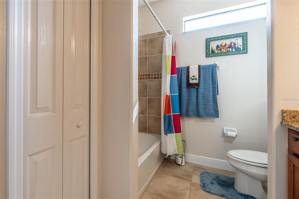 16222 Southwest 14th Avenue Road Ocala, FL 34473 - Photo 37 of 61 a bathroom with a toilet and a shower