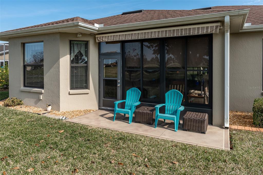 16222 Southwest 14th Avenue Road Ocala, FL 34473 - Photo 46 of 61 a view of a two chair in the patio and a fountain
