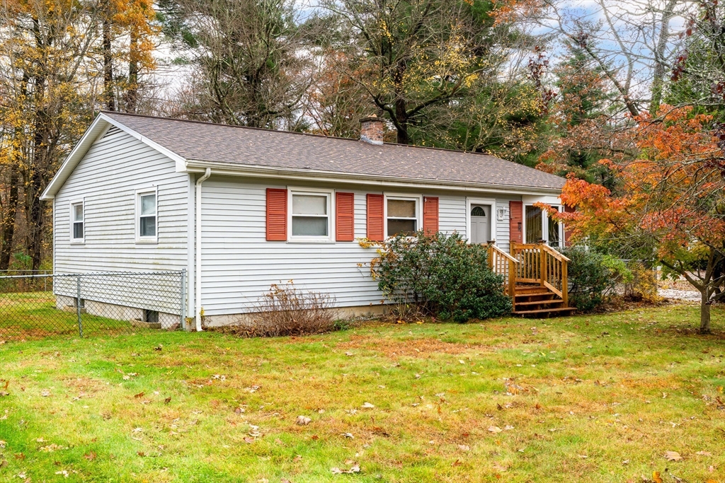 331 Grand Valley Road Springfield, MA 01128 - Photo 1 of 37 a view of a house with a patio and a yard