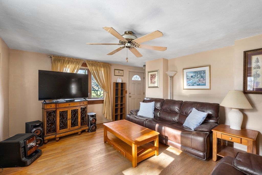331 Grand Valley Road Springfield, MA 01128 - Photo 12 of 37 a living room with furniture and a flat screen tv