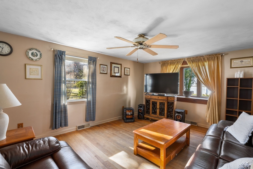 331 Grand Valley Road Springfield, MA 01128 - Photo 13 of 37 a living room with furniture and a flat screen tv