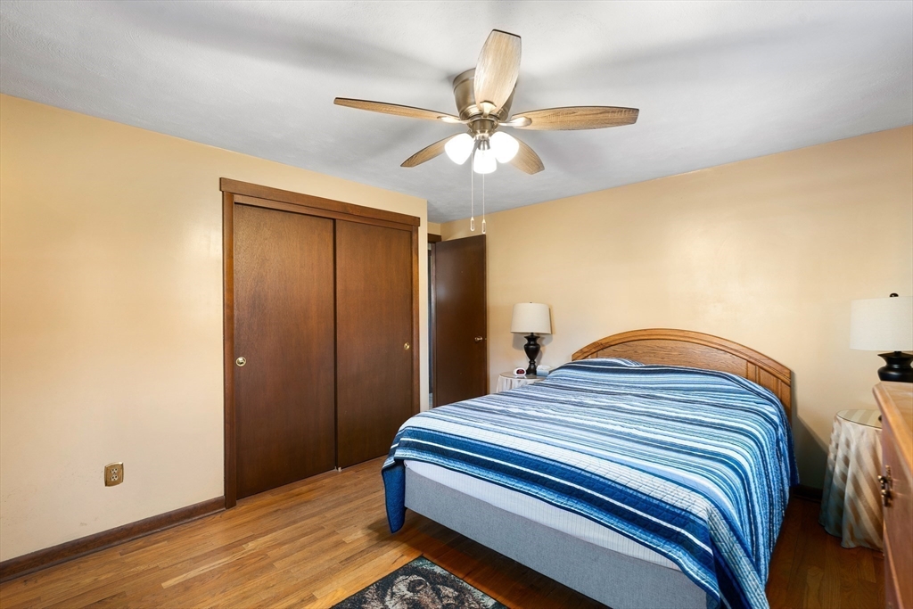 331 Grand Valley Road Springfield, MA 01128 - Photo 24 of 37 a bedroom with a bed and a ceiling fan