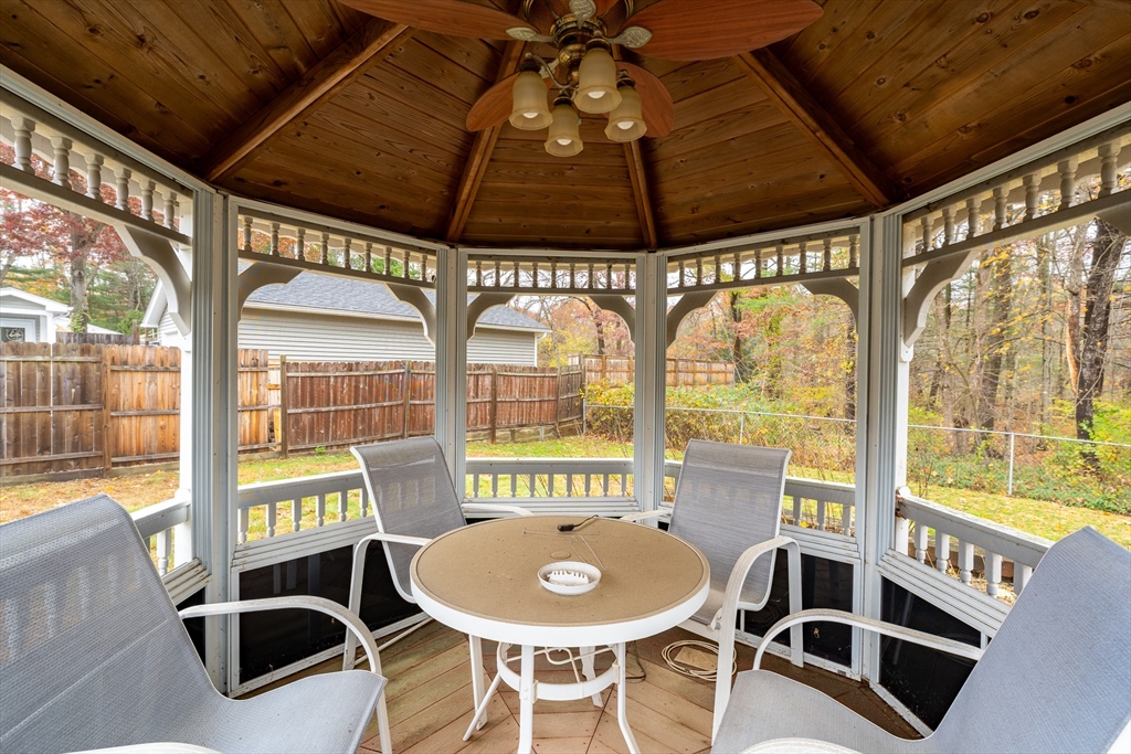 331 Grand Valley Road Springfield, MA 01128 - Photo 33 of 37 a dining room with furniture large windows and wooden floor
