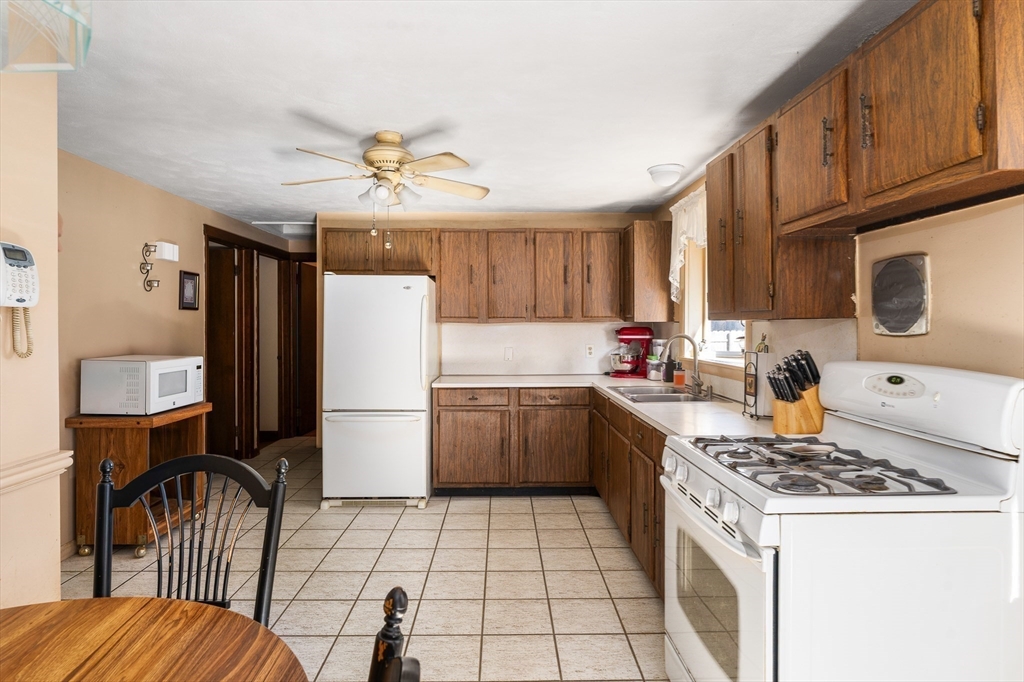 331 Grand Valley Road Springfield, MA 01128 - Photo 7 of 37 a kitchen with a sink appliances and cabinets