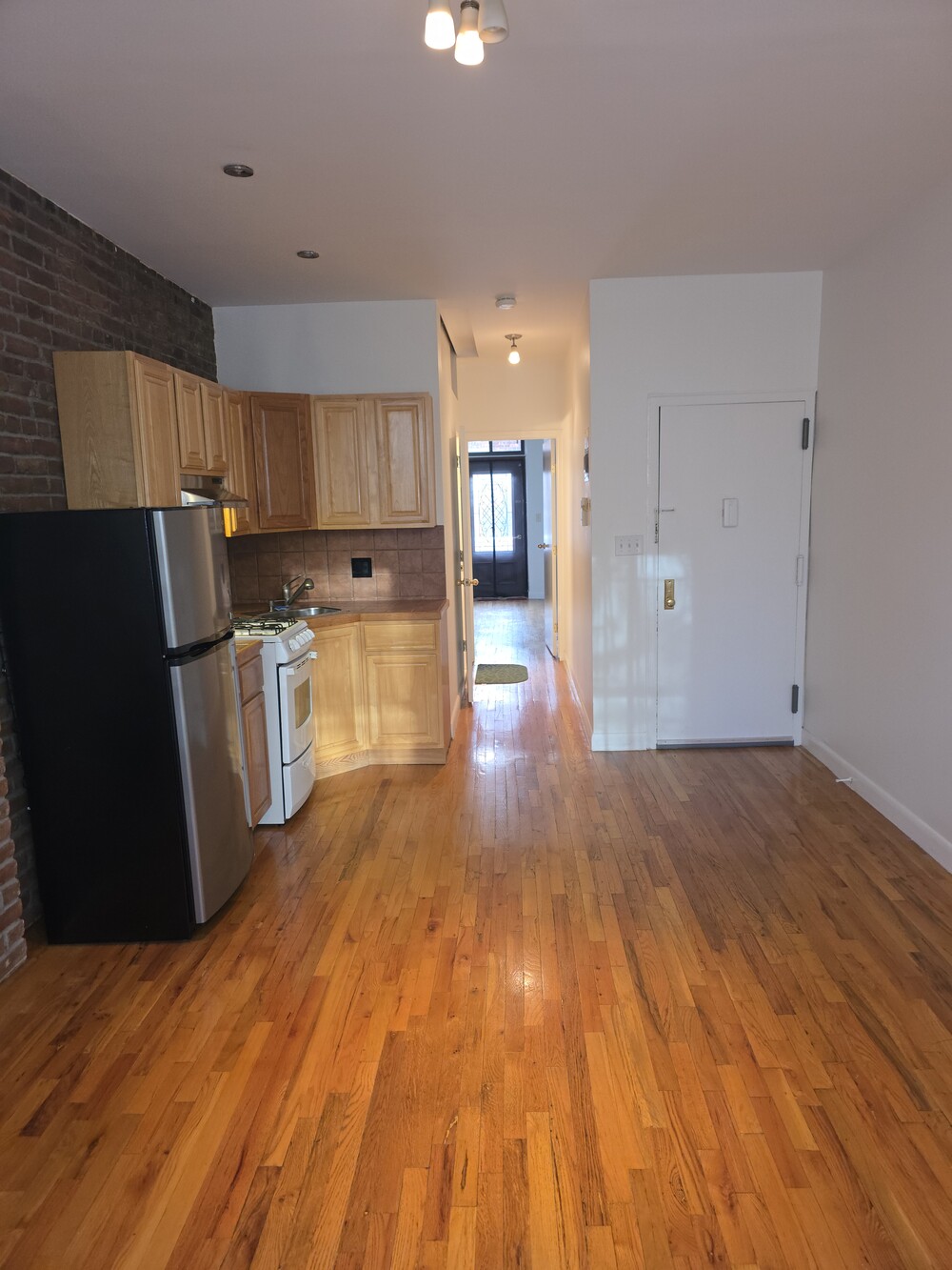 340 Atlantic Avenue, Unit 2L Brooklyn, NY 11201 - Photo 1 of 12 a view of a kitchen with wooden floor