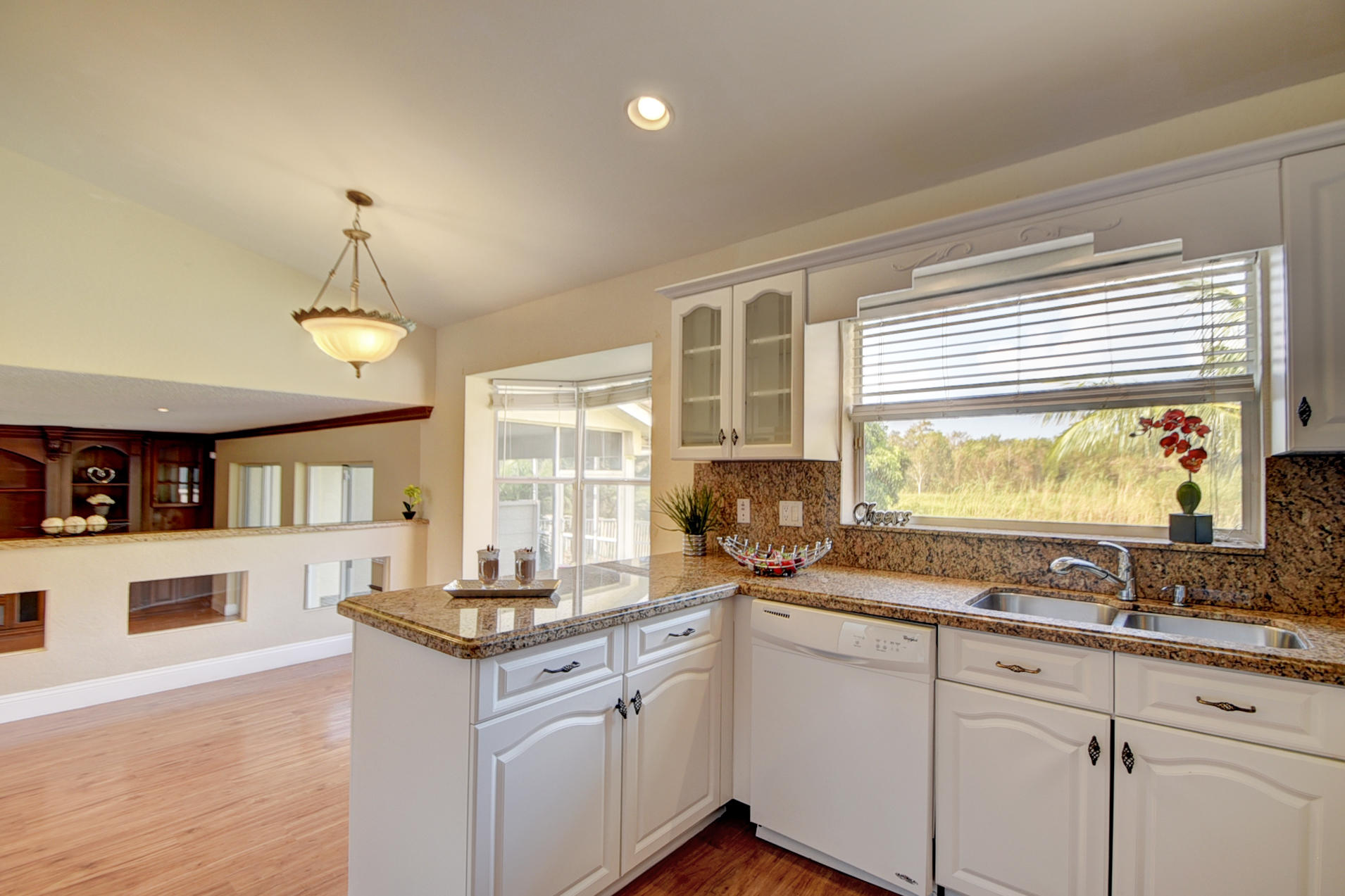 18098 Clear Brook Circle Boca Raton, FL 33498 - Photo 20 of 48 a kitchen with a sink stove and microwave