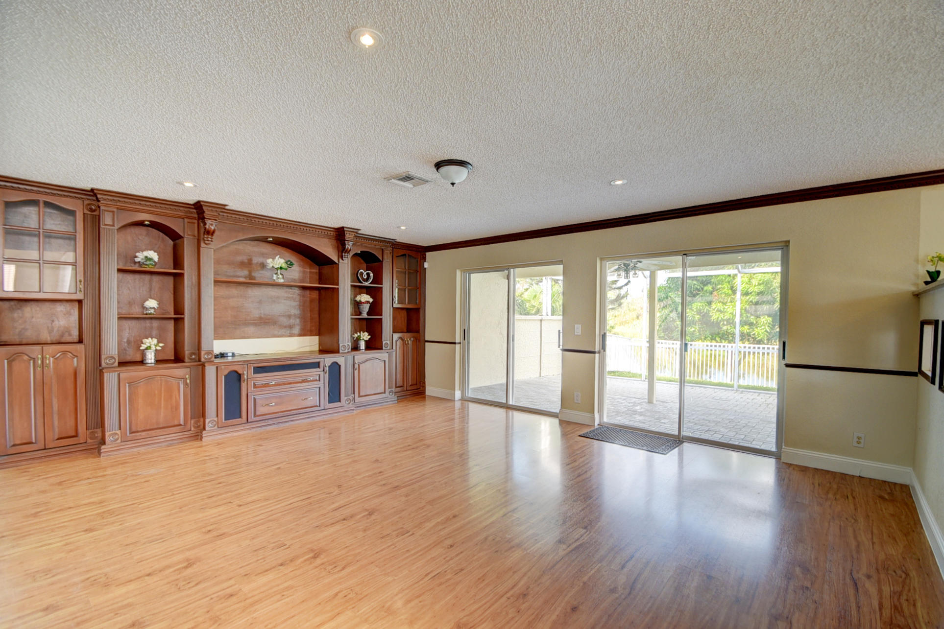 18098 Clear Brook Circle Boca Raton, FL 33498 - Photo 22 of 48 a living room with stainless steel appliances with kitchen view and wooden floor