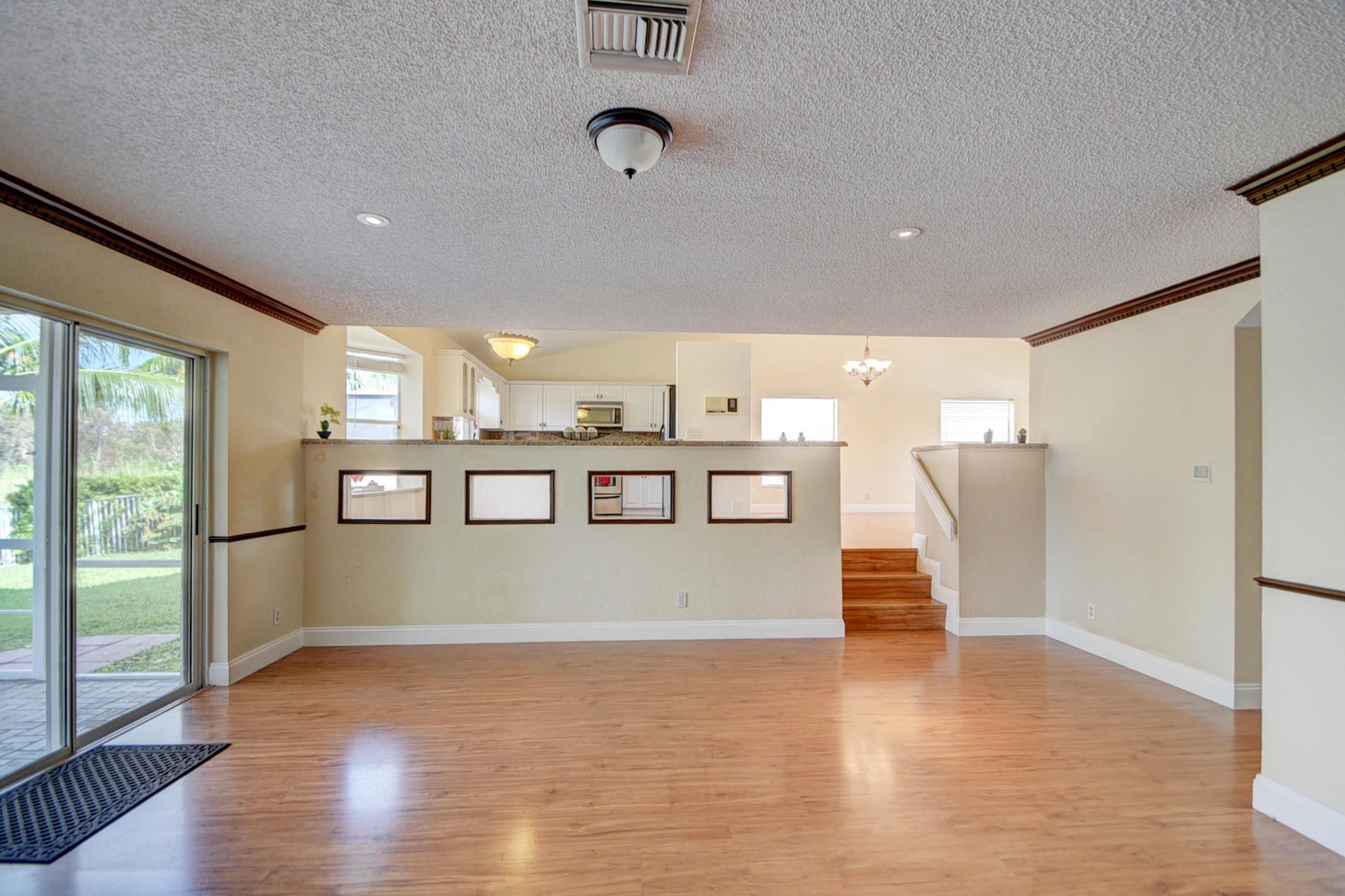 18098 Clear Brook Circle Boca Raton, FL 33498 - Photo 24 of 48 a view of kitchen with stainless steel appliances granite countertop cabinets and wooden floor