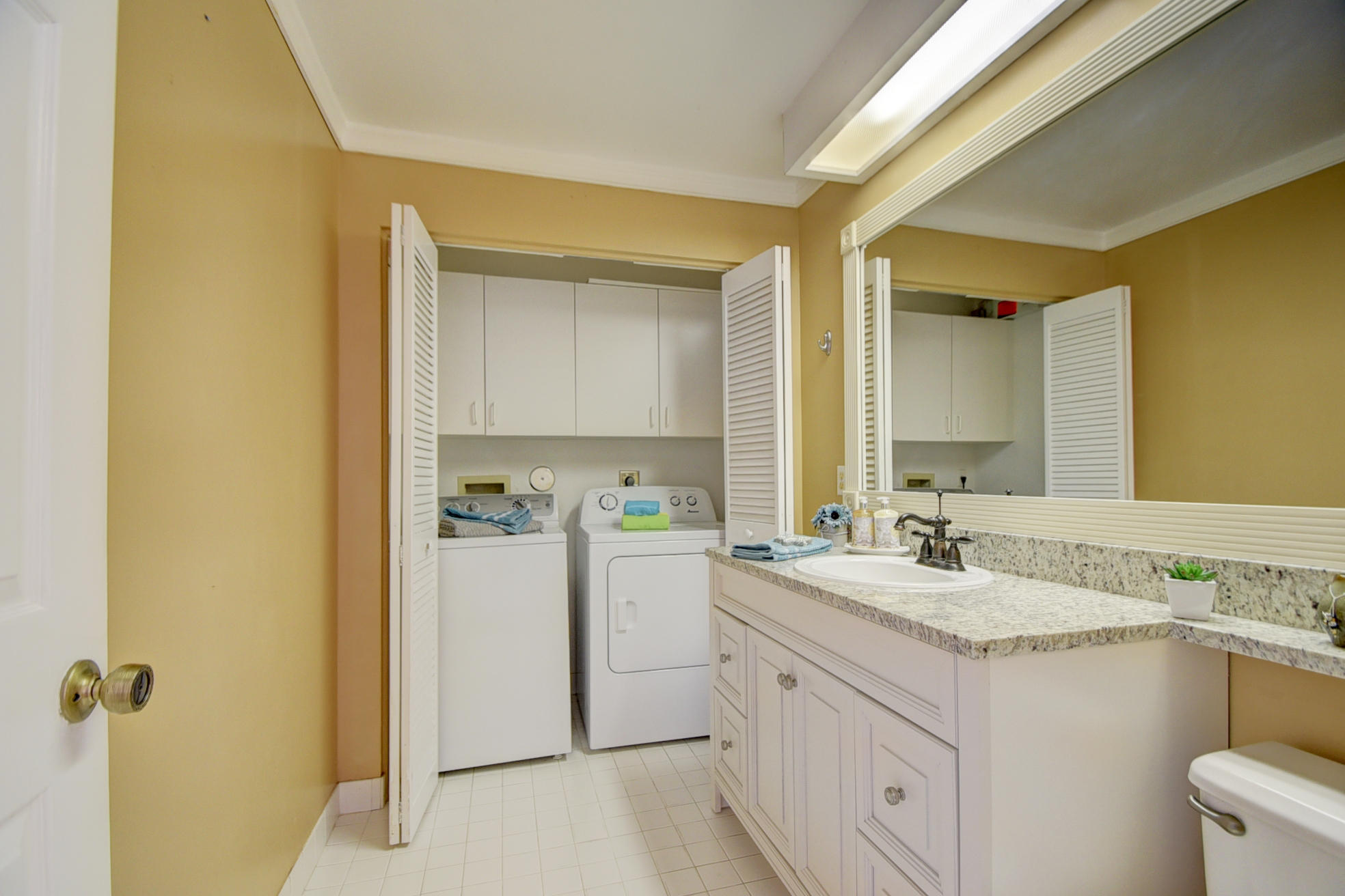 18098 Clear Brook Circle Boca Raton, FL 33498 - Photo 26 of 48 a bathroom with a granite countertop sink mirror and a