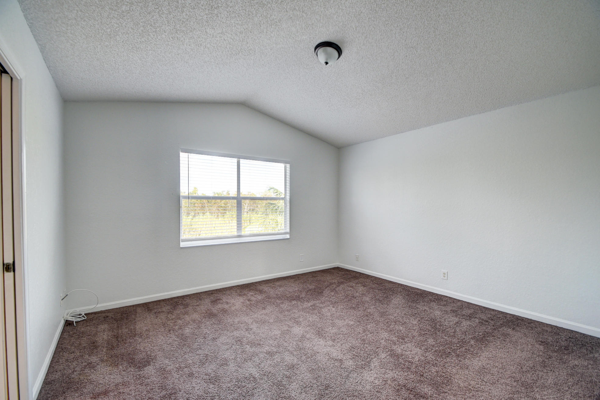 18098 Clear Brook Circle Boca Raton, FL 33498 - Photo 27 of 48 an empty room with a window
