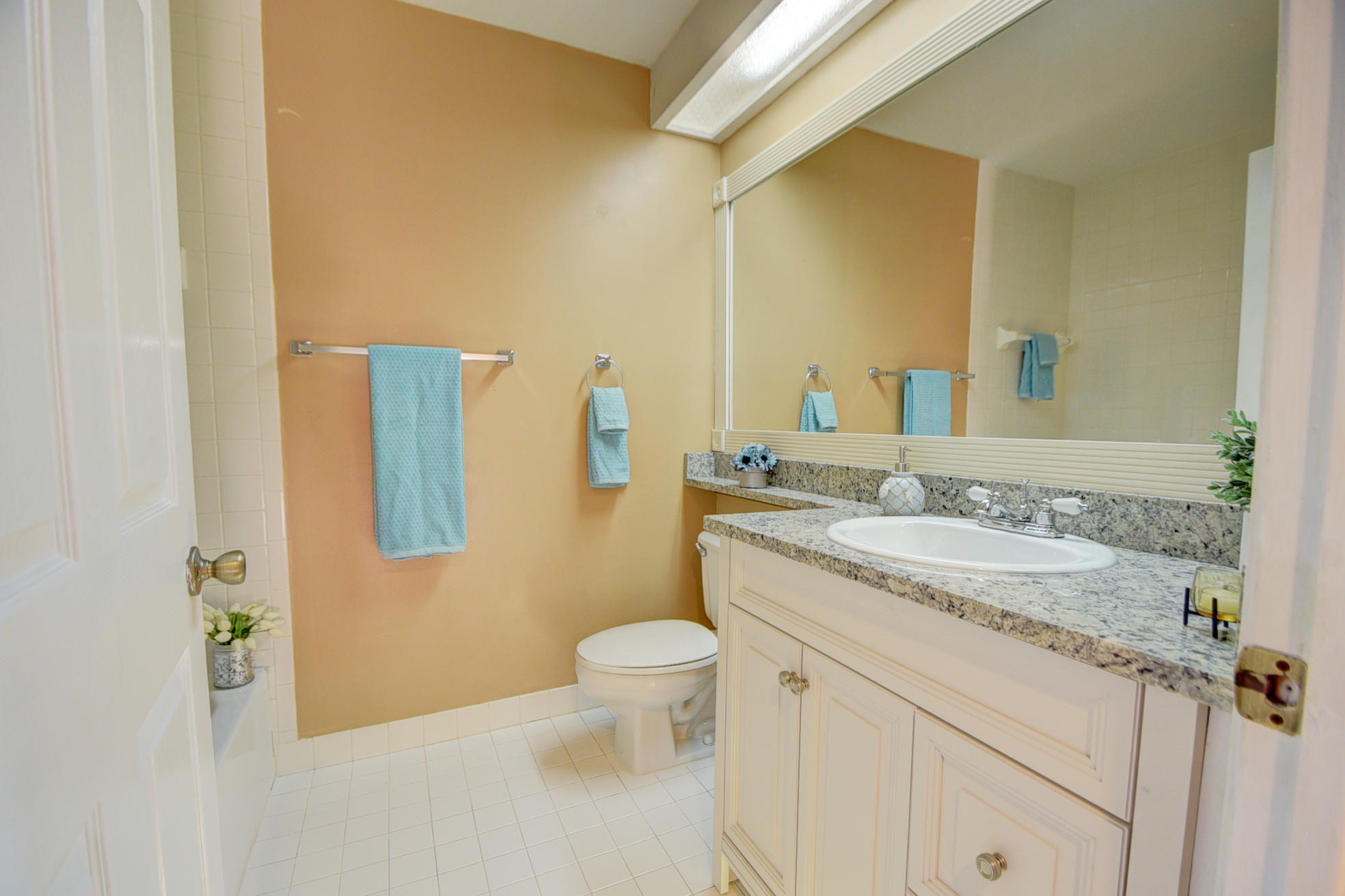 18098 Clear Brook Circle Boca Raton, FL 33498 - Photo 36 of 48 a bathroom with a granite countertop sink a toilet and a mirror