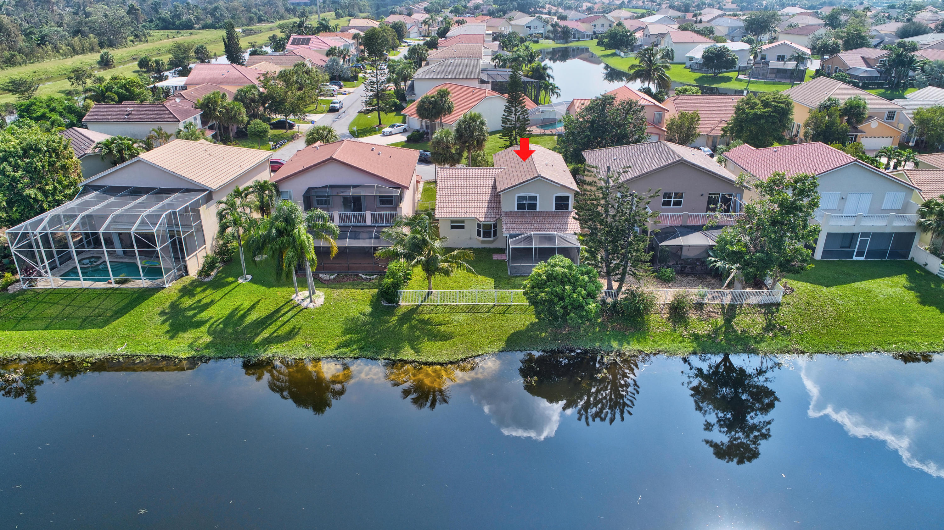 18098 Clear Brook Circle Boca Raton, FL 33498 - Photo 4 of 48 a aerial view of a house with a yard and lake view