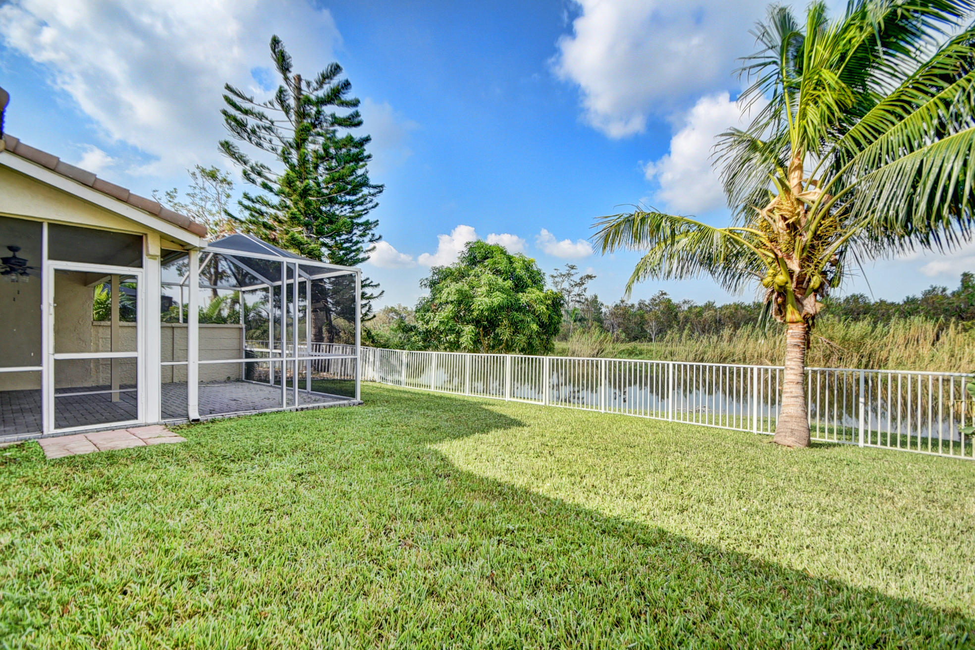 18098 Clear Brook Circle Boca Raton, FL 33498 - Photo 6 of 48 a view of a backyard with a small pool