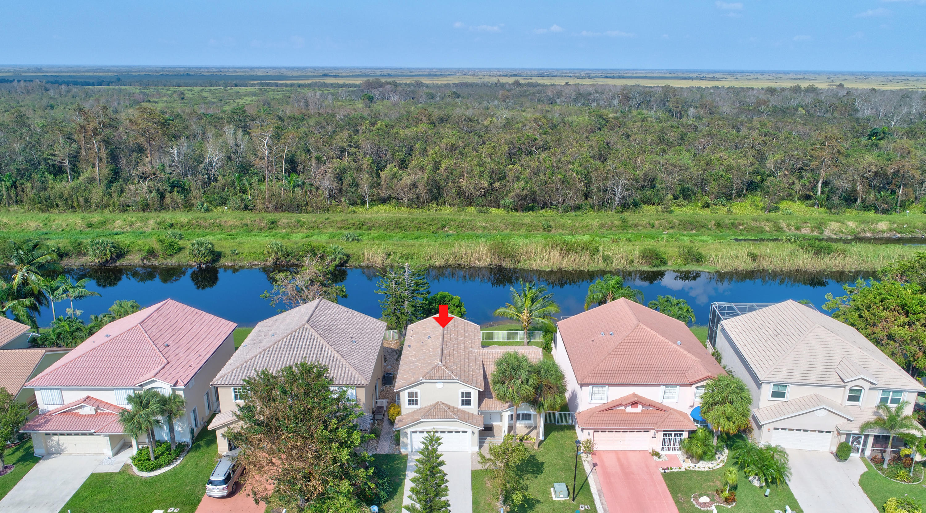 18098 Clear Brook Circle Boca Raton, FL 33498 - Photo 7 of 48 an aerial view of a house with a garden and lake view