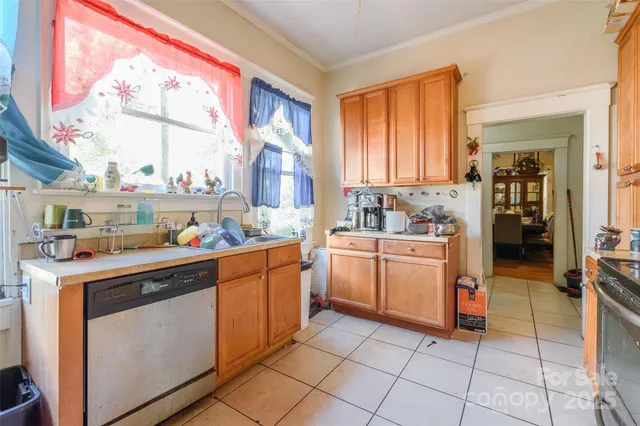 a kitchen with a stove a sink and a refrigerator