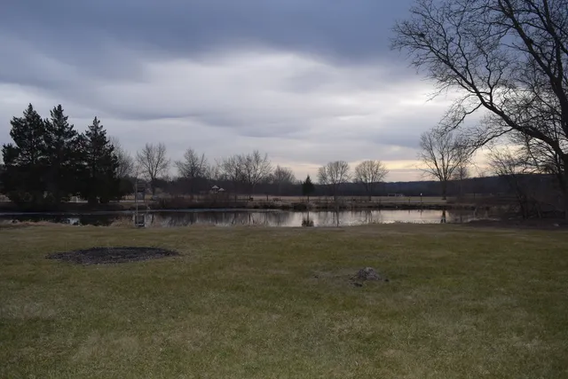 a view of lake with green space