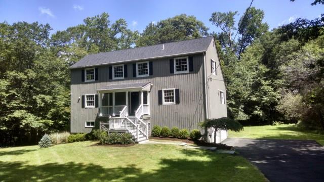 24 Sleepy Hollow Road Ridgefield, CT 06877 - Photo 1 of 1 a front view of a house with a yard